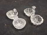 trois plats en verre posés sur une surface noire