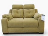 the reclining loveseat has two pillows on the back of it