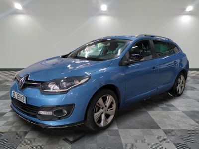 a blue car is parked in a room with a checkered floor