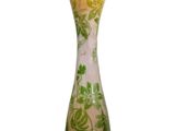 a vase that has a green and white design on it