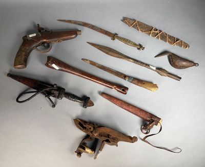 a lot of different types of weapons on the table