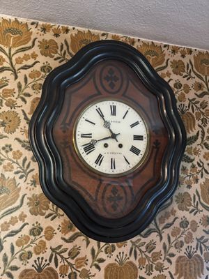 a clock that is hanging on the wall in the room