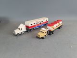 three toy trucks that are sitting next to each other