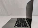 an open laptop computer sitting on top of a white table