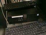 a laptop computer sitting on top of a computer desk