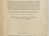an open book on a white surface with a black and white title