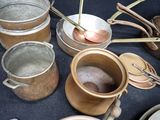 many pots and pans that are on a table