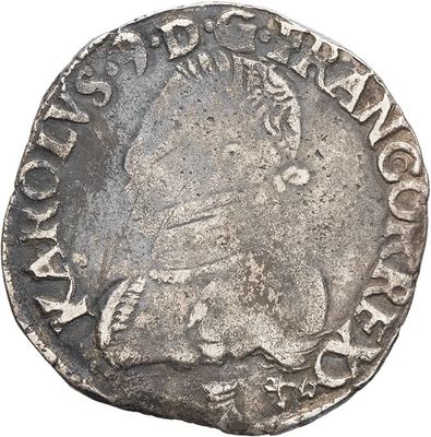 a close up of a silver coin with an image of a man on it