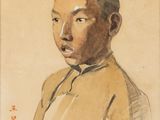 portrait of a young man in a yellow shirt with a red cap