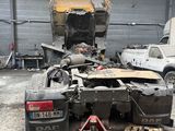 a car that is sitting in the garage with its hood open