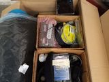 a box with a phone and other items inside of it