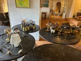 two tables with lamps on top of them in a living room