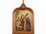 a painting of jesus carrying the cross hanging on the wall