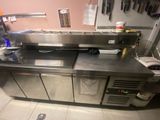 stainless steel counter top in a commercial kitchen with stainless steel cabinets
