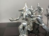mickey mouse figurines are on a black and white checkered surface