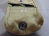 a small pouch with a button on it