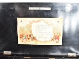 a picture of an old black suitcase with a poem on it