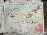 a map of france on a table with a bunch of other maps