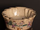 a small bowl with a design on it on a table