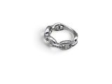 an image of a silver ring on a white surface