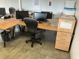 a desk with two computer monitors and a printer on it