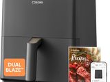 a close up of a digital air fryer with a remote control