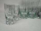 a lot of glasses that are sitting on a table