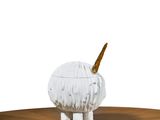 a white and gold animal figurine sitting on a wooden table