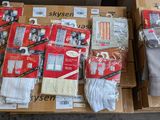 several boxes of socks are stacked on top of each other