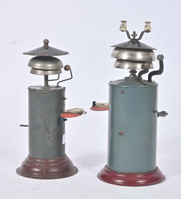 two old fashioned stoves that are sitting side by side