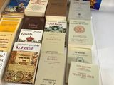 a lot of books that are on a table