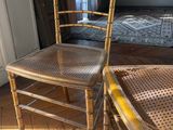 two chairs sitting next to each other in a room