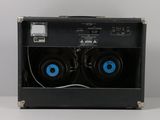 two speakers sitting in the back of a speaker box