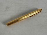 a pen that is laying on a table