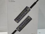 packaging of a black usb charger in a box on a table