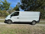 a white van that is parked on the side of the road