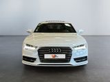the front view of a white audi parked in a showroom