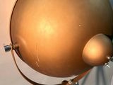 an image of a gold globe lamp on a tripod