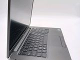 a laptop that is open on a white surface