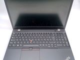 the laptop is open on a white surface with a black keyboard