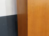 an image of a wooden cabinet in a room