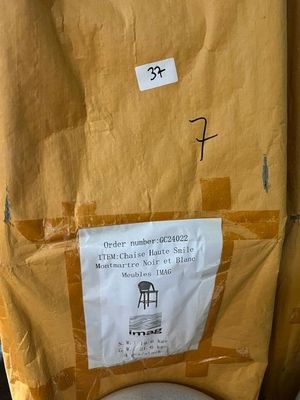 a toilet that has been wrapped in a brown paper bag