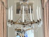 a chandelier hanging from the ceiling in a room