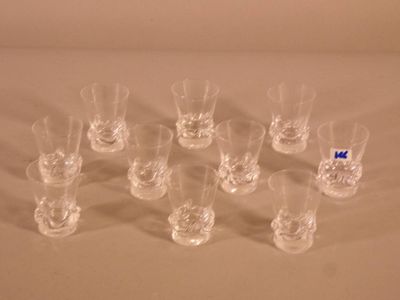 a lot of glasses that are sitting on a table