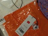 a bag of clothing that is sitting on a table