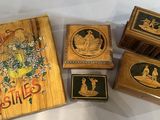 four wooden boxes with pictures of people on them