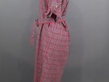a red and white checkered coat on a mannequin mannequin