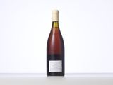 a bottle of wine that is sitting on a table