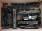 a box with a bunch of toy trains inside of it