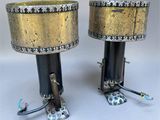 pair of antique brass table lamps with black bases and gold lampshads